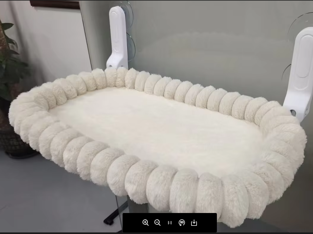 The PetCradle Cat Desk Bed โ a soft raised cradle that attaches to a desk
